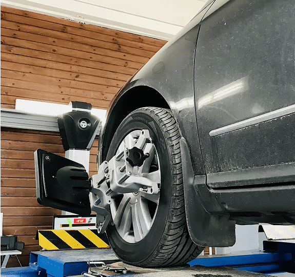 Car on lift for wheel alignment